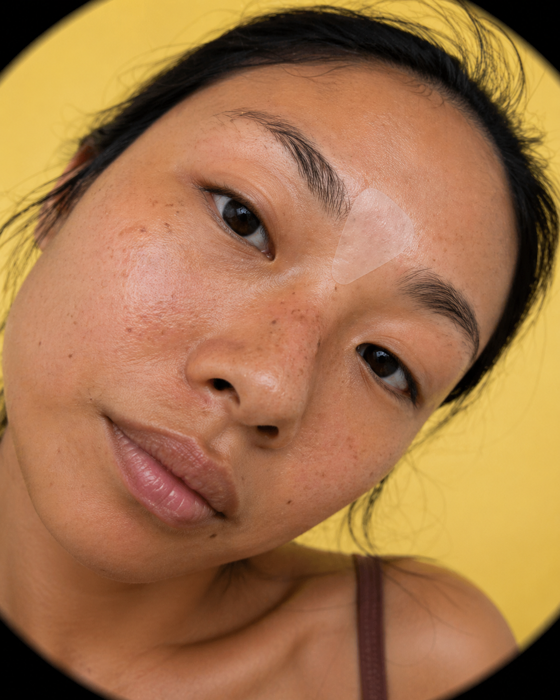 Close-up of a person with a yellow background